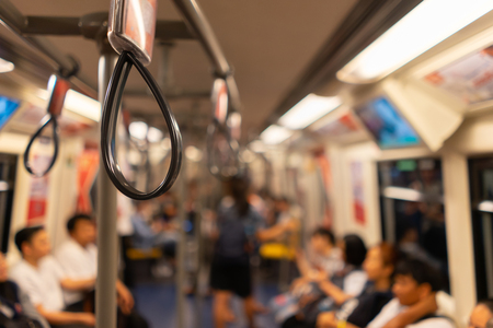 BTS skytrain with office worker in rush hour at Bangkok, Thailand.の写真素材