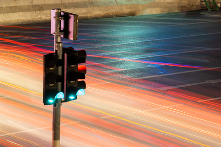 Traffic light with long exposure night in Bangkok, Thailand.