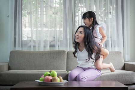 Happy single mom with her daughter, good relationships activities together on weekend.の写真素材