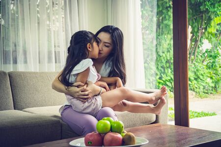 Happy single mom with her daughter, good relationships activities together on weekend.の写真素材