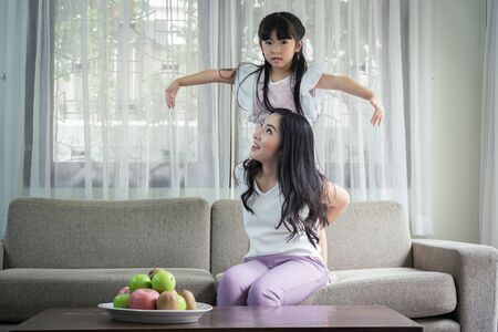 Happy single mom with her daughter, good relationships activities together on weekend.の写真素材