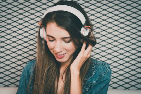 Young beautiful girl enjoy music.の写真素材