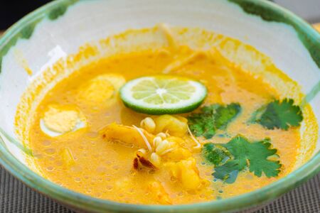 Curry noodle the traditional spicy soup of Asian foodの写真素材