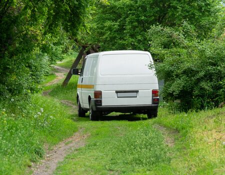 Van in the green forest, the family's vacation time.の写真素材