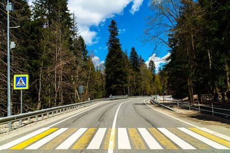Country road with blue skyの写真素材