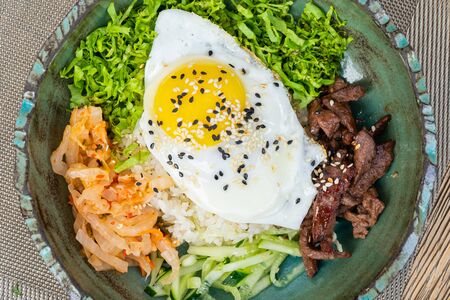 Korean bibimbap rice, a traditional food of Korea top up with meat and vegetables.の写真素材