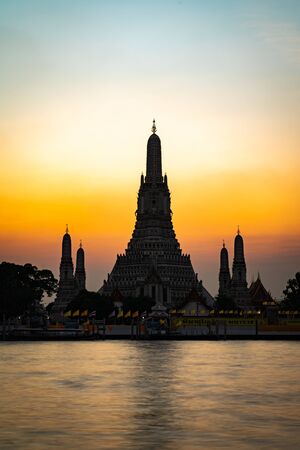 Wat Arun or Temple of Dawn at sunset. One of the most famous temple and tourists attraction in Bangkok, Thailandの写真素材