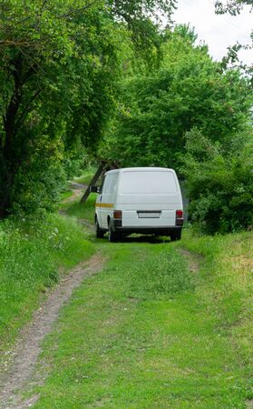 Van in the green forest, the family's vacation time.の写真素材