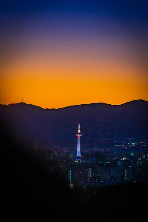 Kyoto tower at dusk when sunset time in Kyoto, Japan.の写真素材