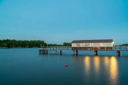 The boat dock in a calm twilight moment at dusk.の写真素材