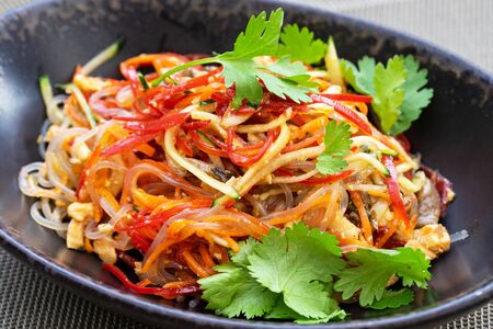 Traditional Korean food - freshy beef salad in black plate.の写真素材