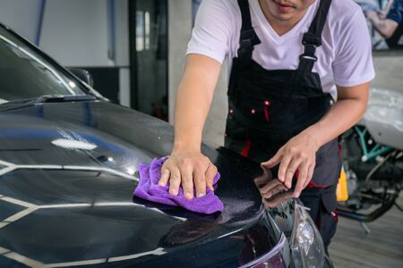 Car cleaning auto service : the man cleaning and polishes. car detailing concepts. Selective focusedの写真素材
