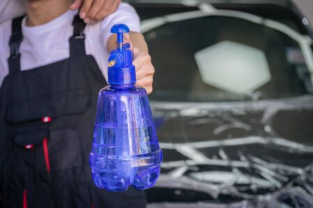 Car wash specialists standing with spray in their hands. selective focusedの写真素材