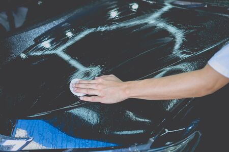Car cleaning auto service : the man cleaning and polishes. car detailing concepts. Selective focusedの写真素材