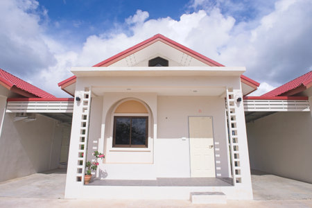 small house, red roof tiles, blue cloud sky background, a little house.の写真素材