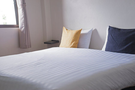 white cozy bedroom, decor idea and design, home interior decoration. side viewの写真素材