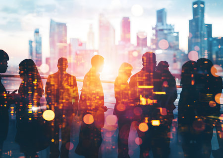 Silhouette of business people work together in the office. Double exposure with highrise modern city office building concepts. Success ,agreement ,teamwork and partnership.の素材