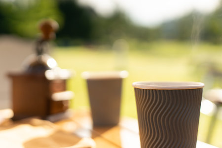 Food lover at Camping! Dripping coffee during camping at natural lake and mountain view background. Recreation and journey outdoor activity lifestyle.の写真素材