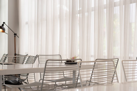 White table with chairs in a coffee shop. Vintage tone.の写真素材