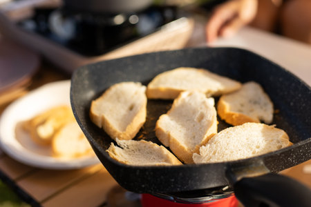 Food lover at Camping! Cooking food during camping at natural lake and mountain view background. Recreation and journey outdoor activity lifestyle.の写真素材