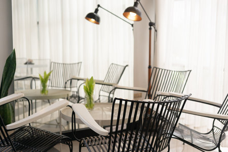 White table with chairs in a coffee shop. Vintage tone.の写真素材