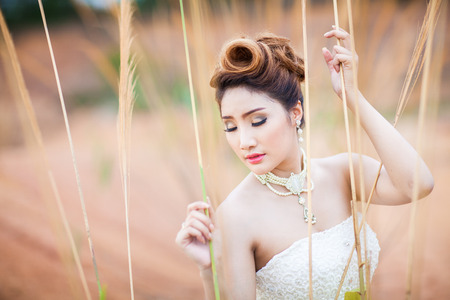 portrait asian beautiful bride in forestの写真素材
