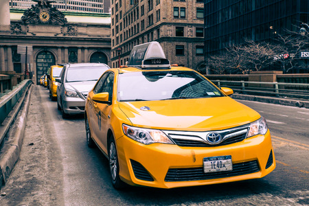 NEW YORK CITY - FEBRUARY 21, 2015: View of yellow taxi and cars on Park Avenue in midtown Manhattan...