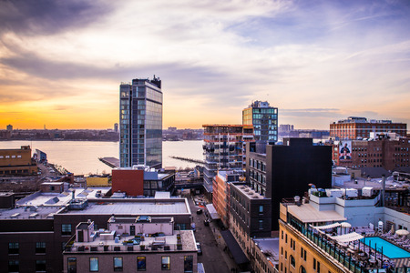 NEW YORK CITY - APRIL 6, 2015: View across Manhattan Meatpacking District and Chelsea from above, at sunset with The Standard Hotel in view.のeditorial素材