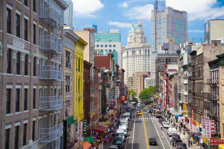 New York City, New York, USA - July 26, 2013: View of Chinatown with cars and pedestrians looking down East Broadway in lower Manhattan towards City Hall.のeditorial素材
