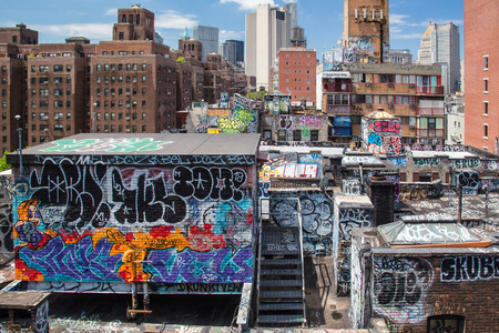 New York City, New York, USA - July 26, 2013:  This is a cityscape of lower Manhattan across graffiti covered apartment buildings looking towards taller skyscrapers.のeditorial素材