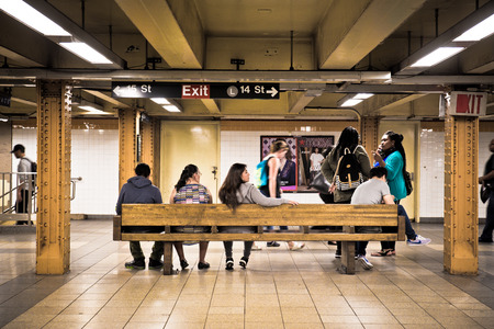 NEW YORK CITY - SEPTEMBER 24, 2015: View of underground subway station at 14th Street in New York City with people waiting.のeditorial素材