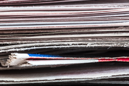 Extreme closeup of stack of newspapersの写真素材
