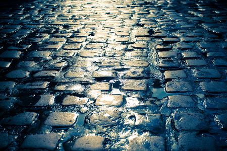 Wet old cobblestone streetの写真素材