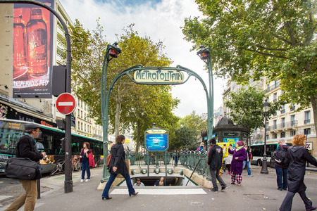 PARIS, FRANCE - OCTOBER 9, 2014: Picture here is a Metro subway entrance street scene in Paris, France with many people visible.のeditorial素材