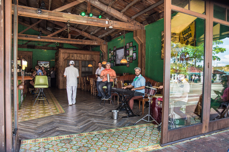 MIAMI, FLORIDA - APRIL 25, 2016: View of musicians at a bar along Calle Ocho in Little Havana, Miami.のeditorial素材
