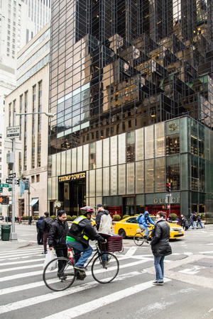 NEW YORK CITY - MARCH 14, 2014: View along fashionable Fifth Avenue in New York City with Trump Tower, people and cars in view.のeditorial素材