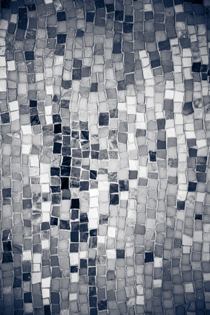 Vintage wall mosaic with rough cut tilesの写真素材