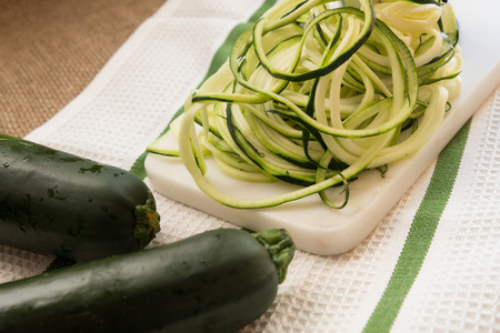Preparing healthy spiral shredded zucchini squashの写真素材