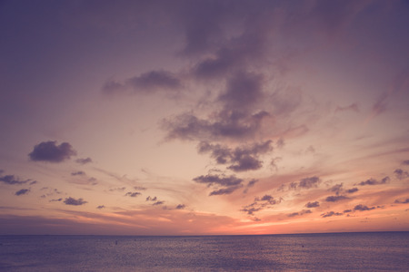 Beautiful beach scene with  sea and sunset sky with vintage toneの写真素材