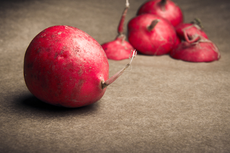 Red radishes whole and slicedの写真素材