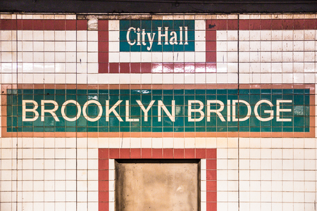 New York City subway station at City Hall with vintage tile wall and sign for Brooklyn Bridgeのeditorial素材