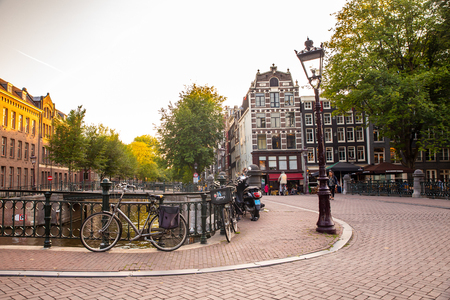 AMSTERDAM, NETHERLANDS - SEPTEMBER 1, 2018:  Beautiful view of the city of Amsterdam at canal bridge and architecture in viewのeditorial素材
