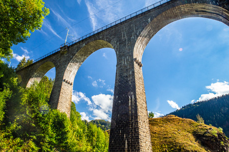 Arched railroad train overpass through the Black Forest in Germanyの写真素材