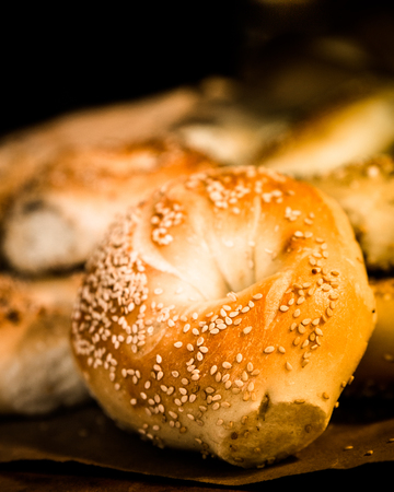 Assortment of fresh baked authentic New York style seeded bagelsの写真素材