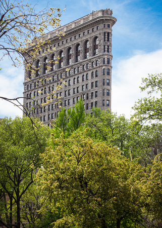 Beautiful Flatiron Building surrounded by springtime trees, New York City