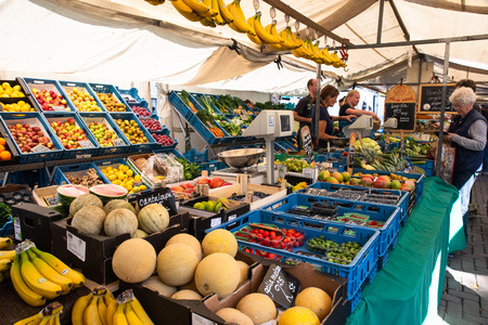 AMSTERDAM, NETHERLANDS - SEPTEMBER 1, 2018:  View from organic Farmers Market in Amsterdam with a variety of produce and people visibleのeditorial素材