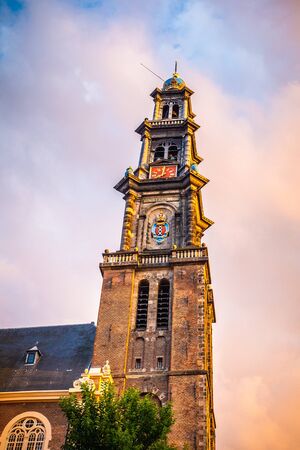 Details view of landmark Westerkerk Church in Amsterdam at sunsetの写真素材
