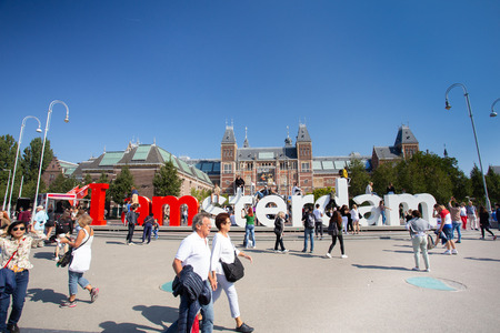 AMSTERDAM, NETHERLANDS - SEPTEMBER 2, 2018: View of visitors at the I Amsterdam sign with the historic Rijksmuseum in the backgroundのeditorial素材
