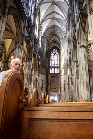 COLOGNE, GERMANY - SEPTEMBER 4, 2018: Interior view of historic Saint Peters Cathedral Domkirche with people and architectureのeditorial素材
