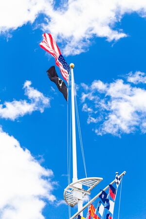 WANTAGH, NEW YORK - MAY 24, 2019: View of flagpole with American, POW and marine flags in the central mall at Jones Beach State Park.のeditorial素材
